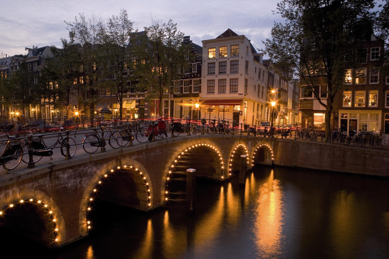 Bridge with lights in the evening in Amsterdam